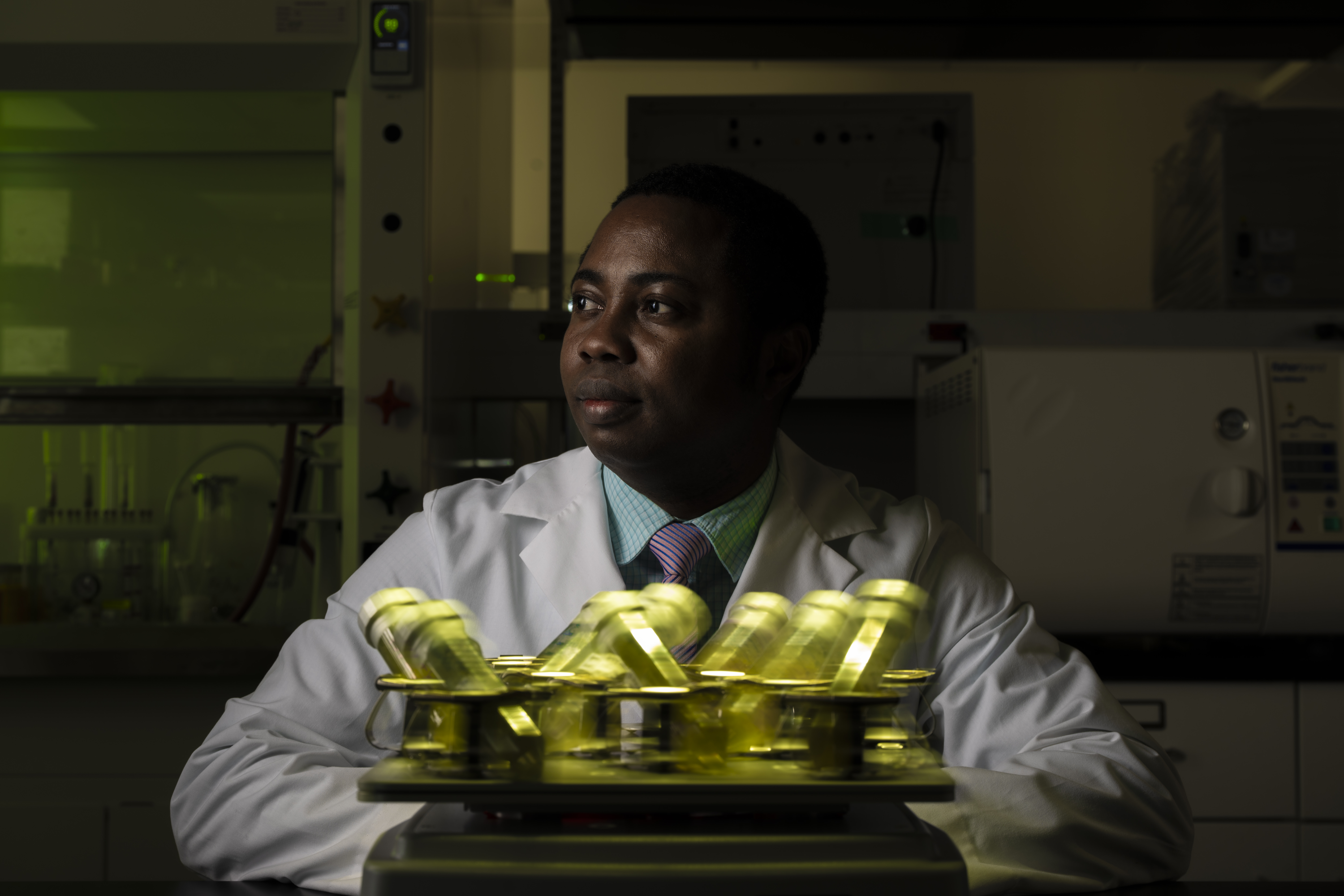 Dr. Eze in the research lab with samples